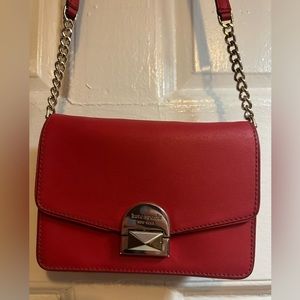 Red crossbody bag, great statement accessory.